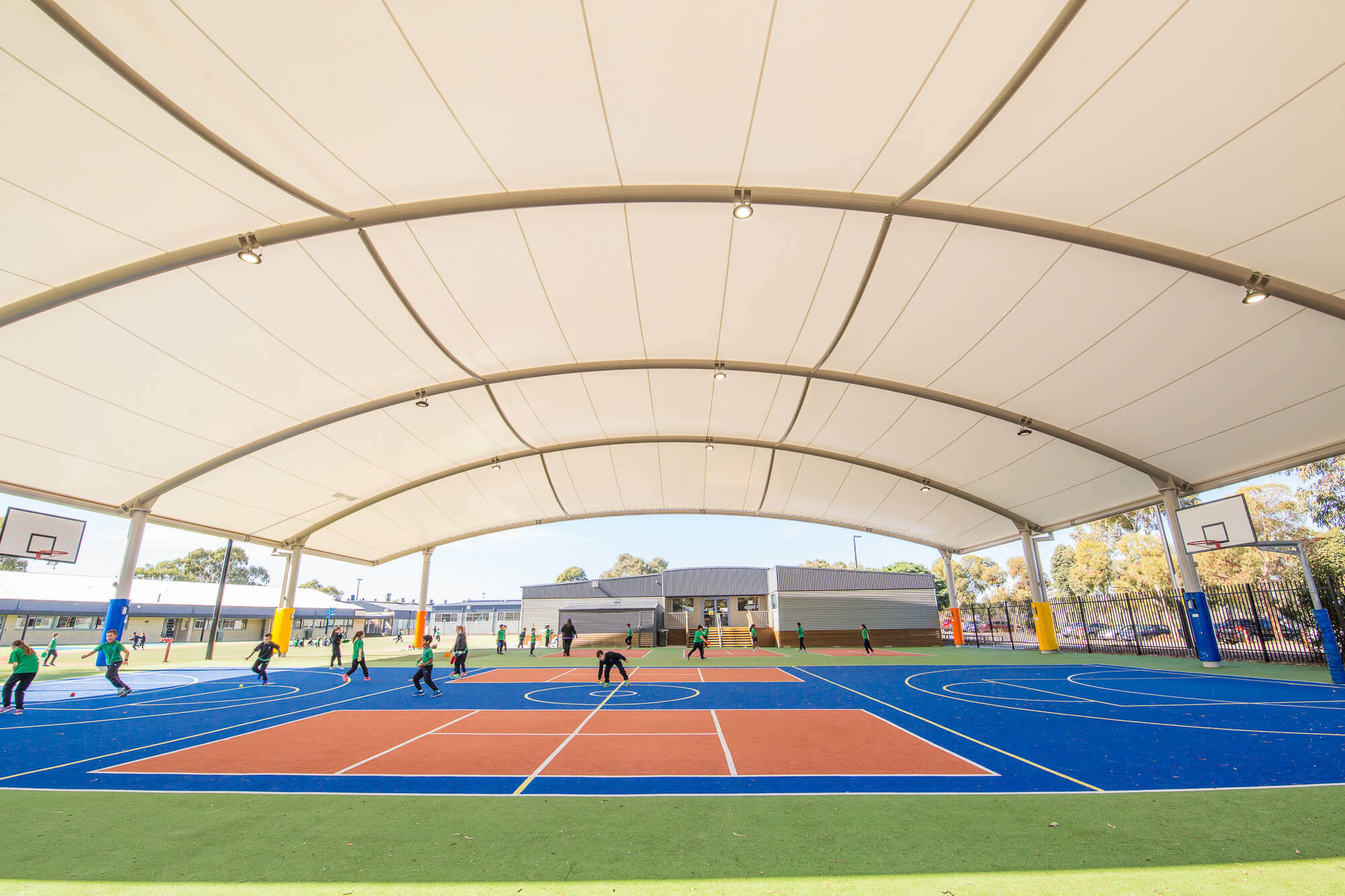 Photo of students playing under the PVC cover at Marymede Catholic College. 