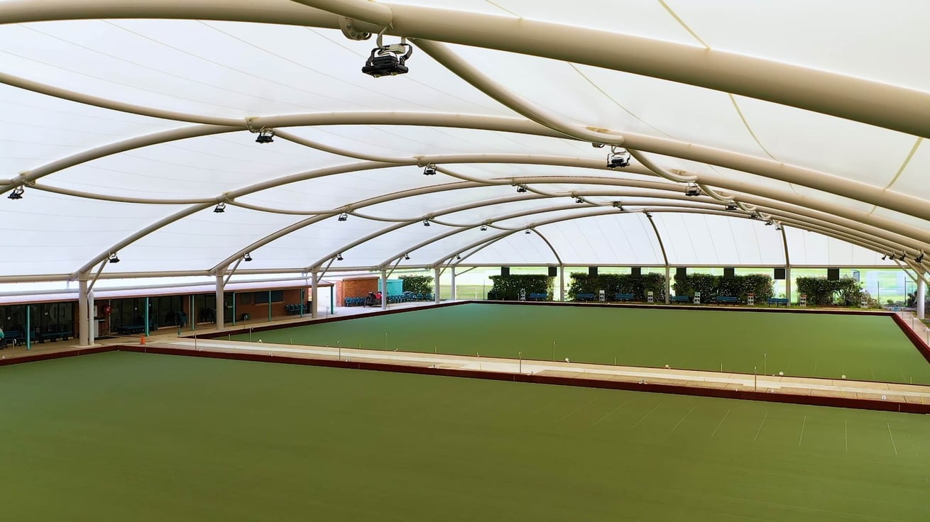 School courtyard in Narre Warren shaded by uniform green shade sails arranged in a grid.