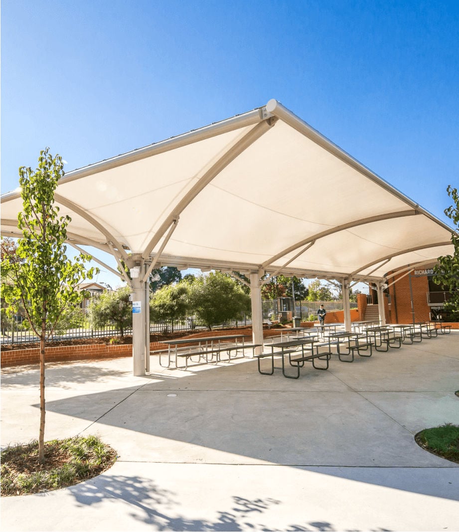 Cantilever shade structure over an outdoor learning area