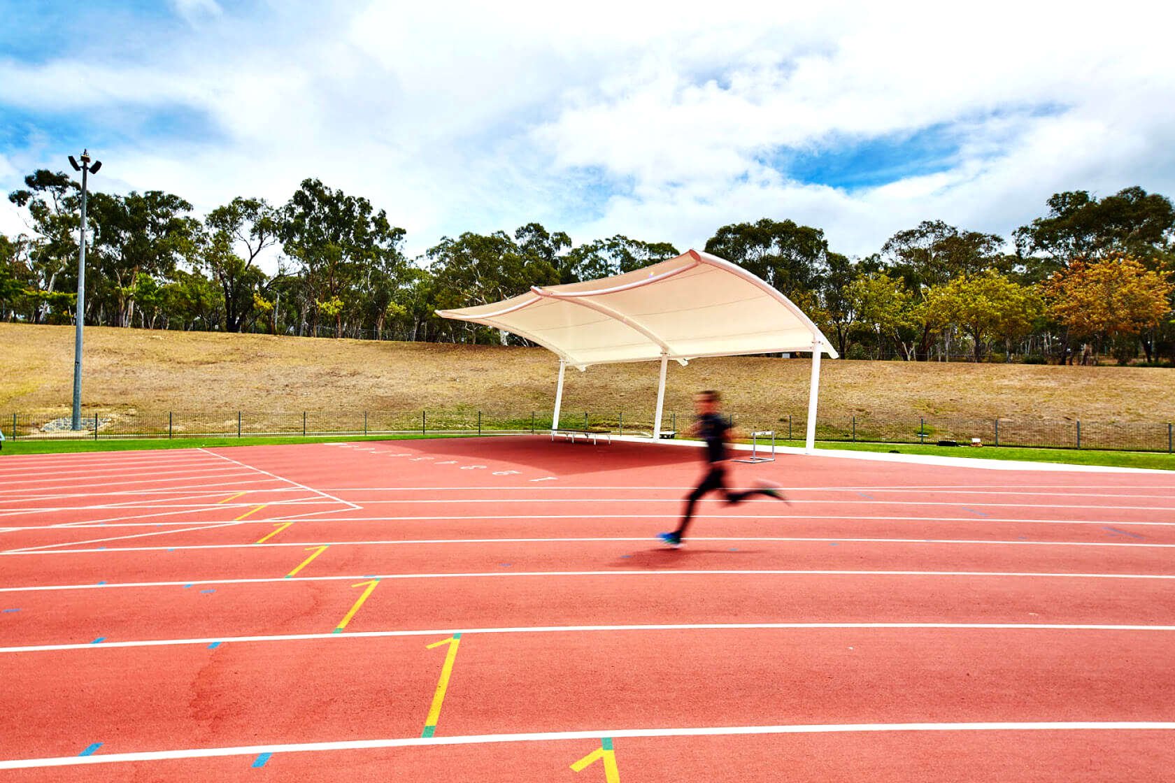 Simple cantilever shade structure at a running track