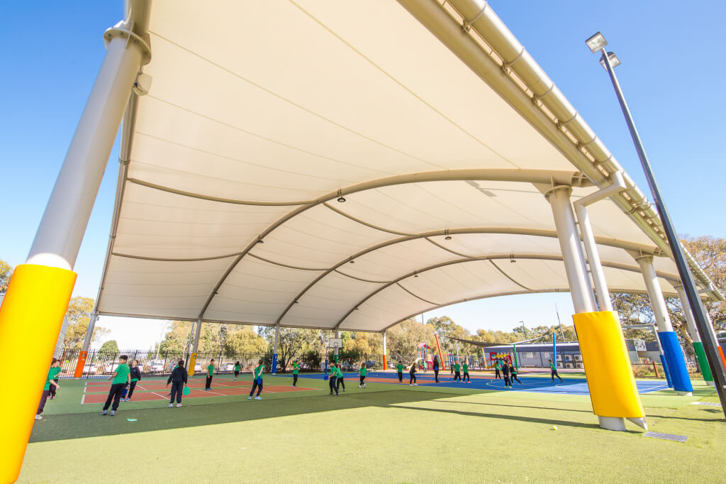 Photo of students playing on the courts under the cover at Marymead Catholic College in Melbourne. 