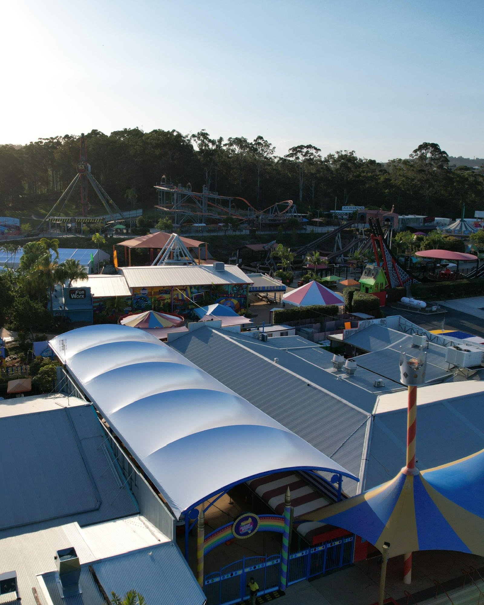 Tensile structure blending in with surrounding architecture